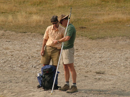 two men looking at a map