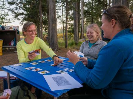 Image of TBI faculty, staff, and students playing cards.