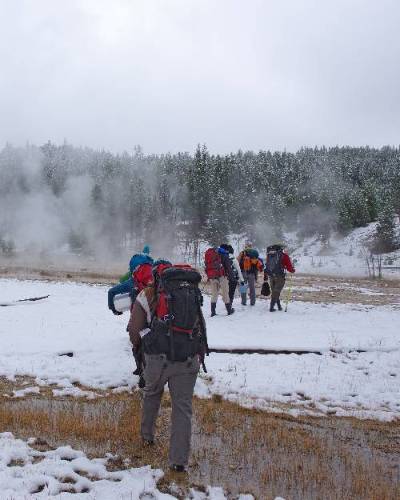 Image of student faculty group trekking through the snow