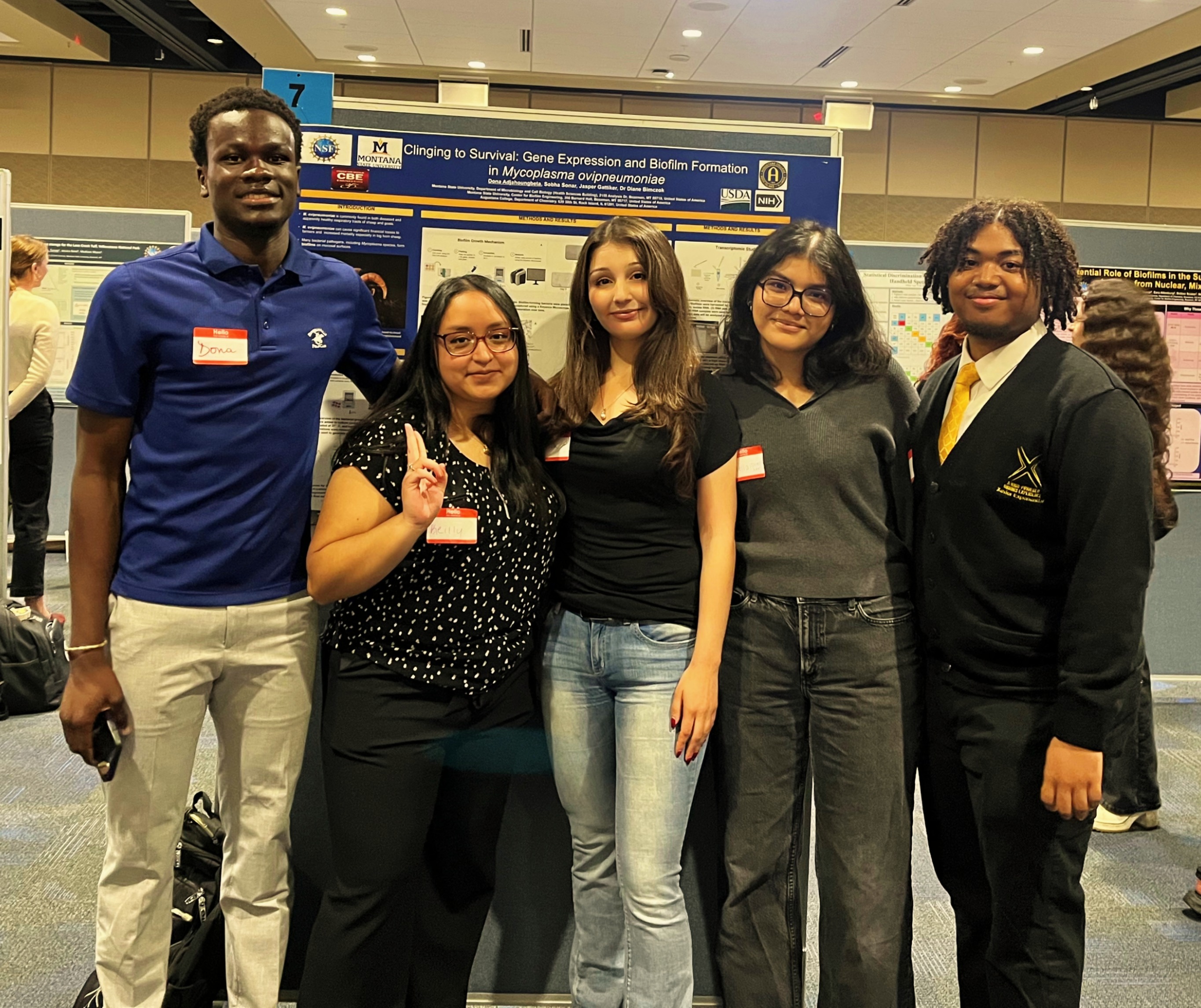 REU students presenting their research projects at the 2025 summer symposium